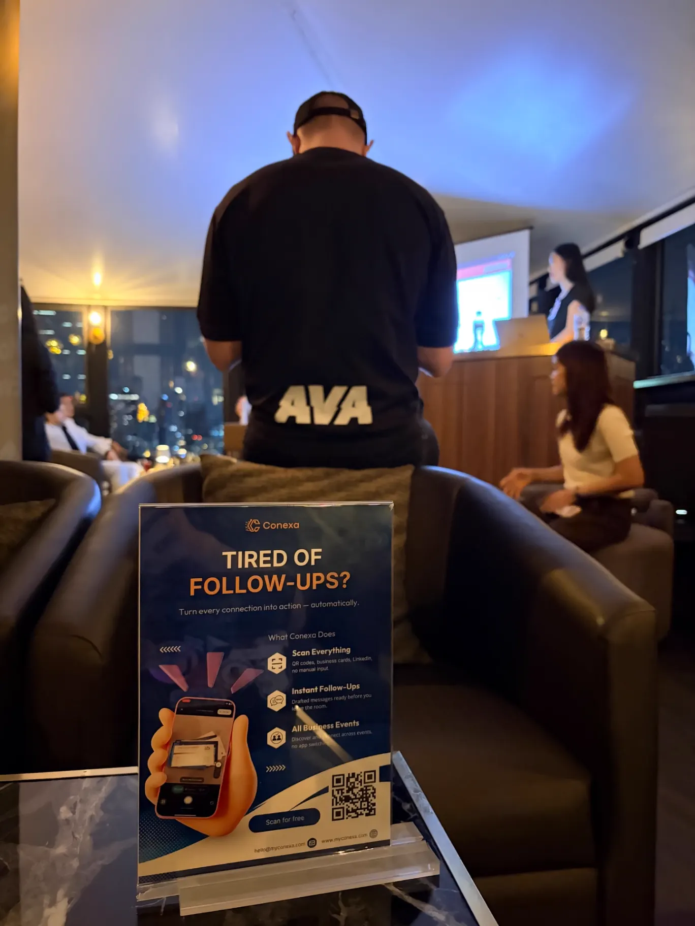 Event signage on a table during an evening community session
